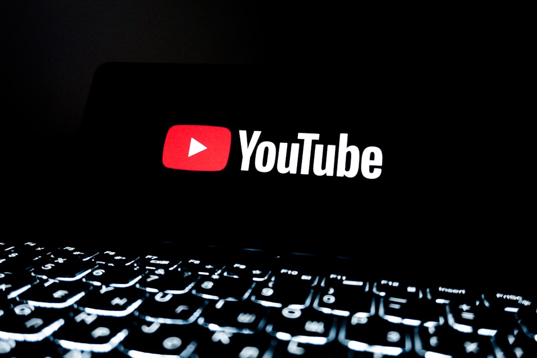 who-we-are youtube-logo-displayed-on-a-dark-screen-above-keyboard-ulphh-frgco